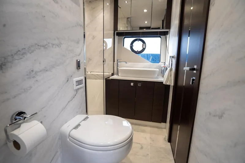 Slide: The Image of Luxurious bathroom in 2020 Sunseeker 74 Predator yacht with modern fixtures and marble accents. - 36