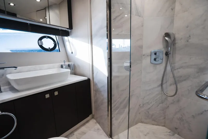 Slide: The Image of Luxurious bathroom in 2020 Sunseeker 74 Predator yacht with marble finishes and modern fixtures. - 38