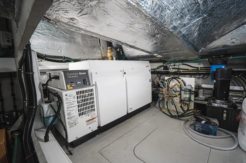 Slide: The Image of Engine room of 2020 Sunseeker 74 Predator yacht, featuring Cummins Onan generator and advanced equipment. - 46
