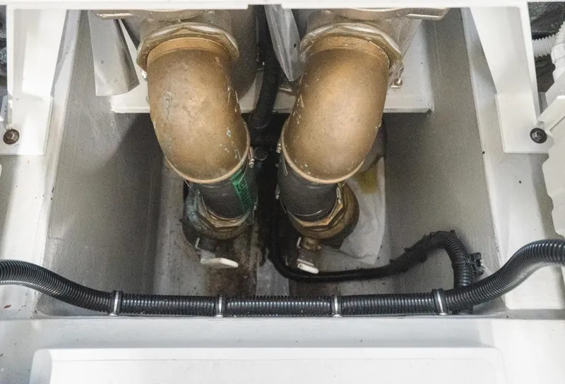 Slide: The Image of Engine compartment of 2020 Sunseeker 74 Predator yacht, featuring dual exhaust pipes. - 48