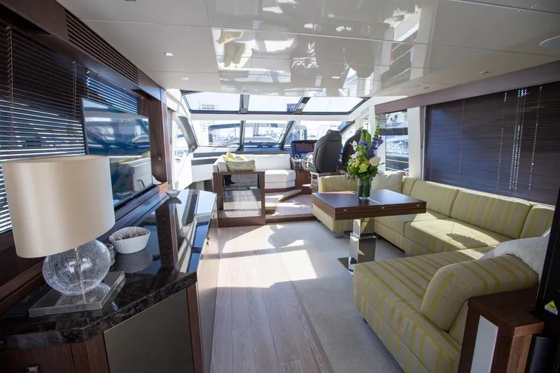 Slide: The Image of Luxurious interior of 2020 Sunseeker 74 Predator yacht with modern furnishings and ample natural light. - 7