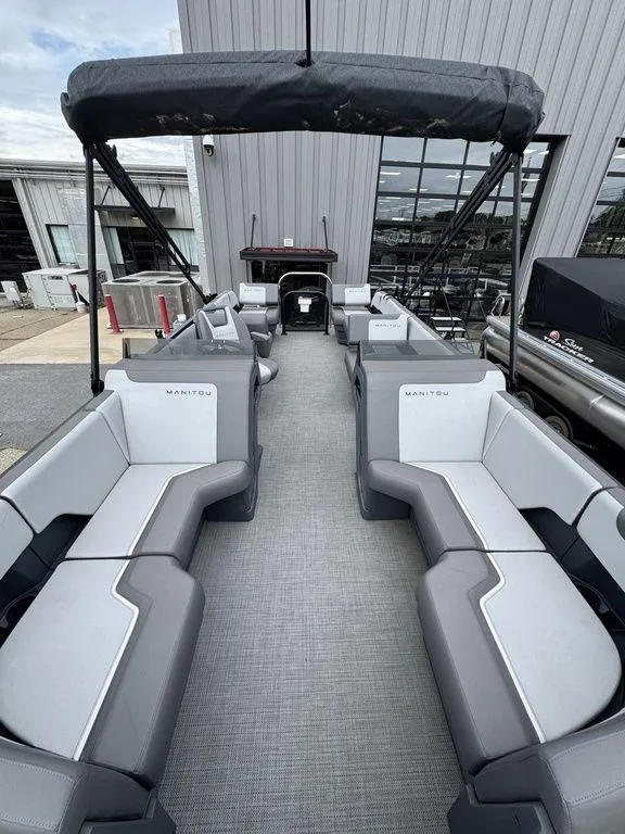 Slide: The Image of 2024 Manitou Cruise 22 Switchback pontoon boat with spacious seating and modern design. - 6