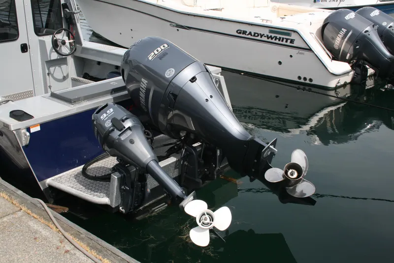 Slide: The Image of 2023 Hewescraft 210 Sea Runner ET HT with dual outboard motors docked. - 13