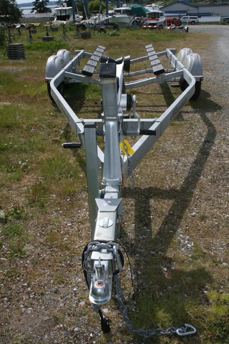 Slide: The Image of Trailer for 2023 Hewescraft 210 Sea Runner ET HT on gravel surface. - 17