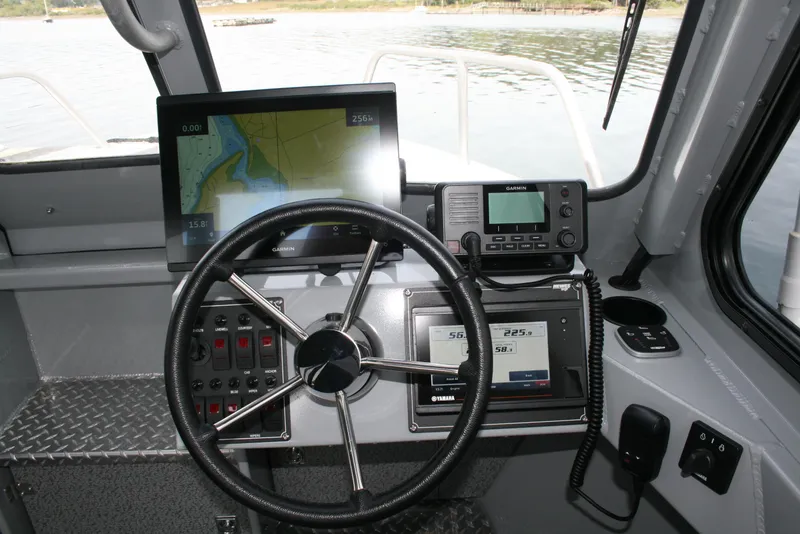 Slide: The Image of 2023 Hewescraft 210 Sea Runner ET HT dashboard with navigation and control systems. - 7
