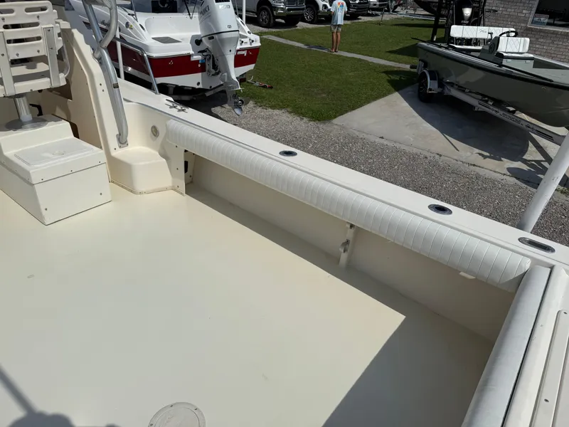 Slide: The Image of 2004 Parker 2510 Walkaround boat interior with seating and deck view. - 13