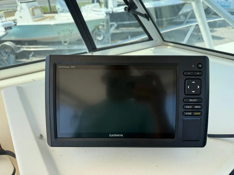 Slide: The Image of Garmin marine GPS device on 2004 Parker 2510 Walkaround boat dashboard. - 18