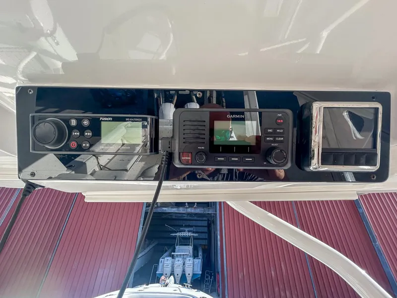 Slide: The Image of Control panel of 2020 Edgewater 262 CX boat with navigation and communication systems. - 15