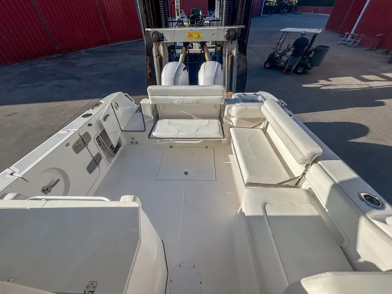 Slide: The Image of 2020 Edgewater 262 CX boat interior with spacious seating and storage. - 19