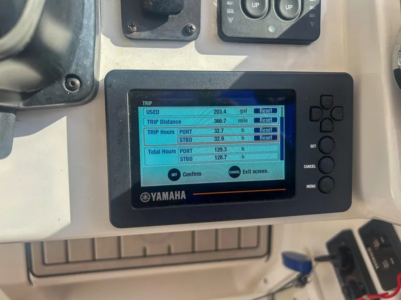 Slide: The Image of Yamaha display on 2020 Edgewater 262 CX showing trip data and fuel usage. - 20