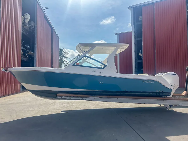Slide: The Image of 2020 Edgewater 262 CX boat in storage facility, side view. - 3