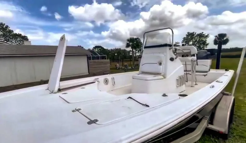 Slide: The Image of 2014 Sportsman TOURNAMENT 214 boat on trailer, under cloudy sky. - 2