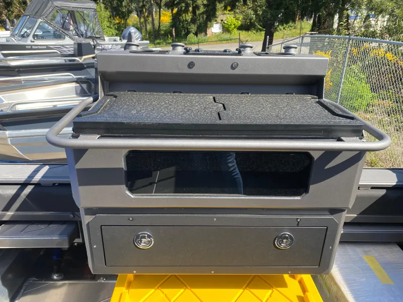 Slide: The Image of 2025 Stabicraft 2350 Supercab boat interior with storage compartments and sleek design. - 15