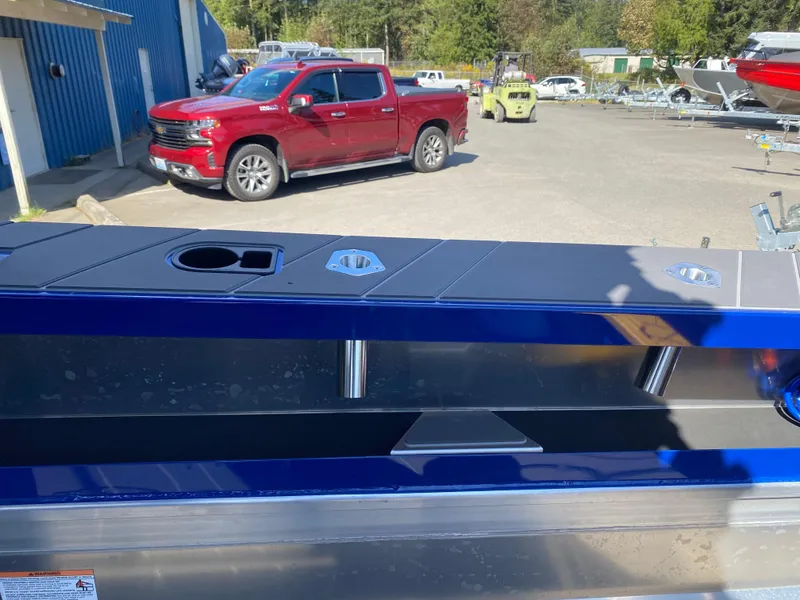 Slide: The Image of Stabicraft 2350 Supercab 2025 model with a red truck in the background. - 9