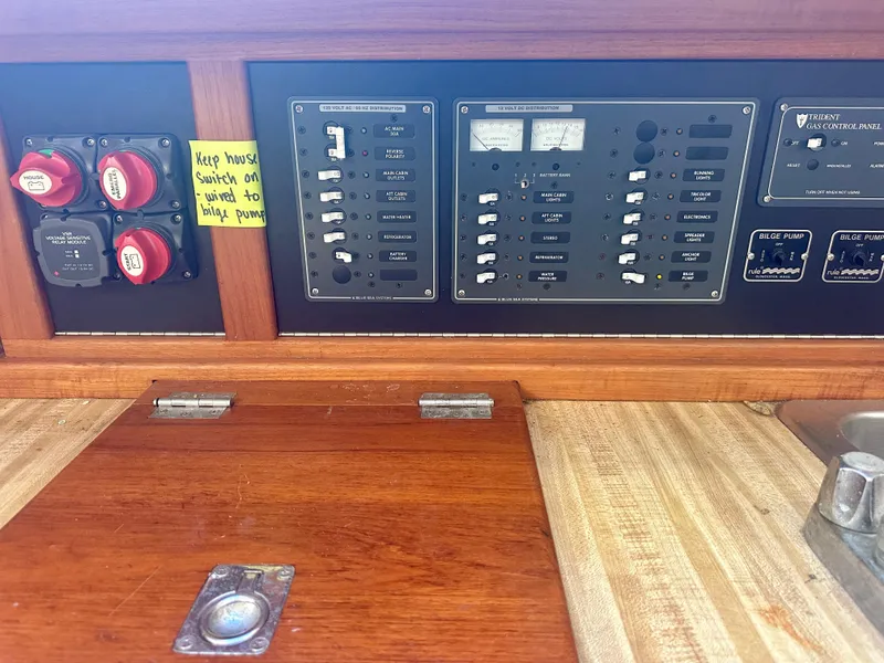 Slide: The Image of Electrical panel of a 1979 O'Day Center Cockpit sailboat with switches and gauges. - 21