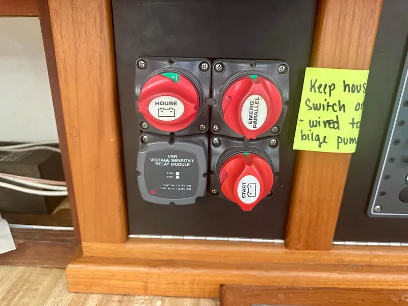 Slide: The Image of 1979 O'Day Center Cockpit control panel with switches and voltage module. - 22