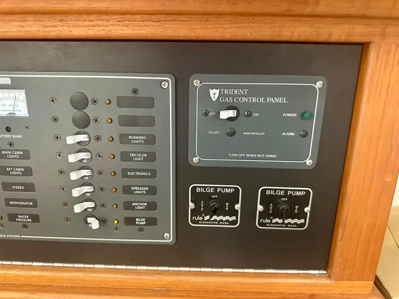 Slide: The Image of Control panel of a 1979 O'Day Center Cockpit sailboat with gas and bilge pump switches. - 24