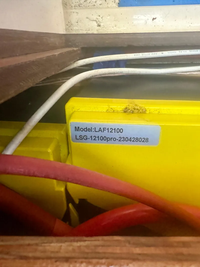 Slide: The Image of Battery compartment with cables in a 1979 O'Day Center Cockpit sailboat. - 27