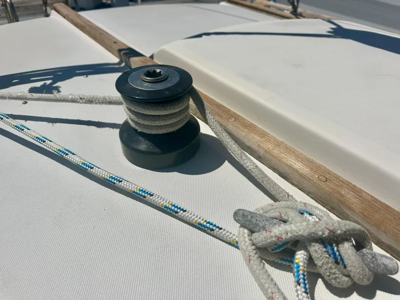 Slide: The Image of 1979 O'Day Center Cockpit sailboat deck with winch and ropes. - 32