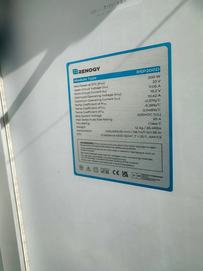 Slide: The Image of Renogy solar panel specifications label on a 1979 O'Day Center Cockpit boat. - 34