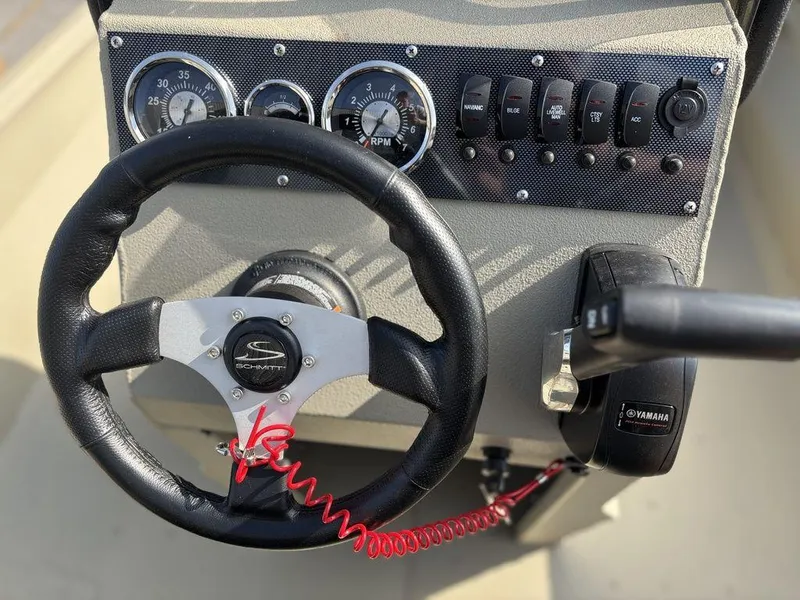 Slide: The Image of Steering wheel and dashboard of 2025 Havoc 1965 UCC boat with Yamaha controls. - 13