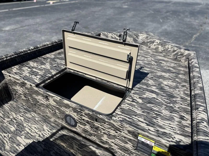 Slide: The Image of Open storage compartment on 2025 Havoc 1965 UCC boat with camouflage pattern. - 17