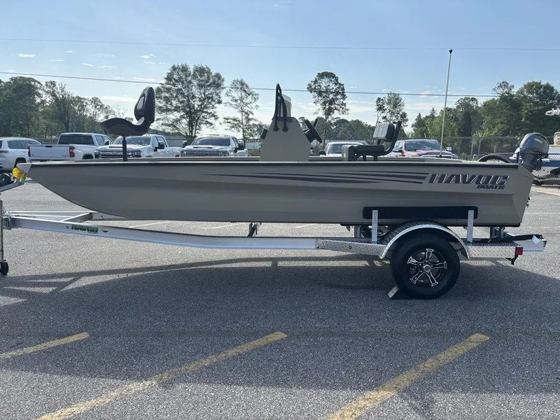 Slide: The Image of Havoc 1965 UCC 2025 model boat on trailer in parking lot. - 6