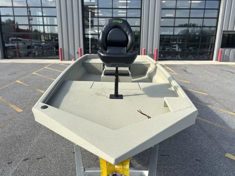 Slide: The Image of Fishing boat with single seat, Havoc 1965 UCC model, 2025, parked outside a building. - 9