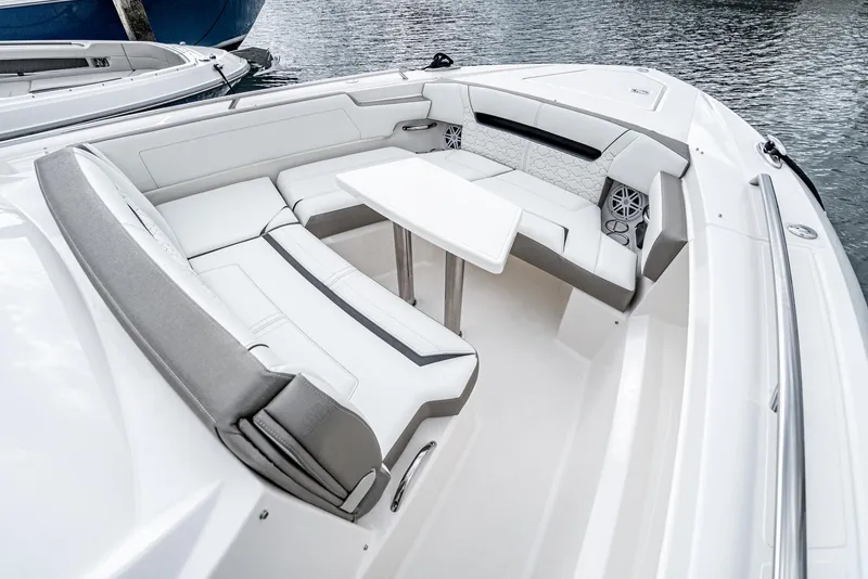 Slide: The Image of 2024 Tiara Yachts 34 LS boat interior with white seating and table. - 13