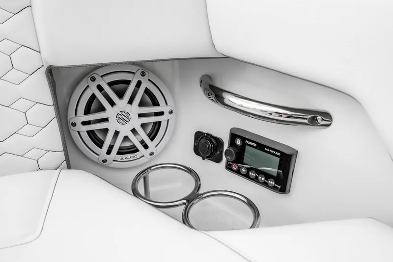 Slide: The Image of 2024 Tiara Yachts 34 LS interior with speaker, control panel, and cup holders. - 14