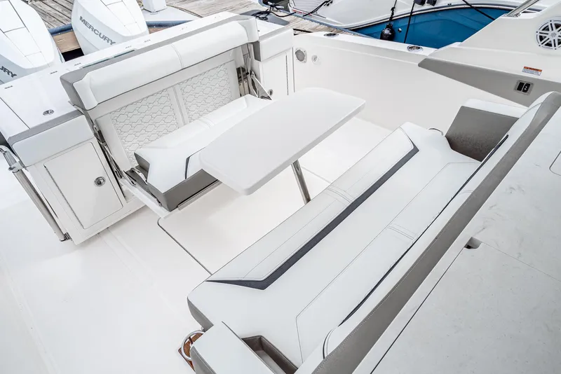 Slide: The Image of 2024 Tiara Yachts 34 LS interior with sleek seating and table arrangement. - 23