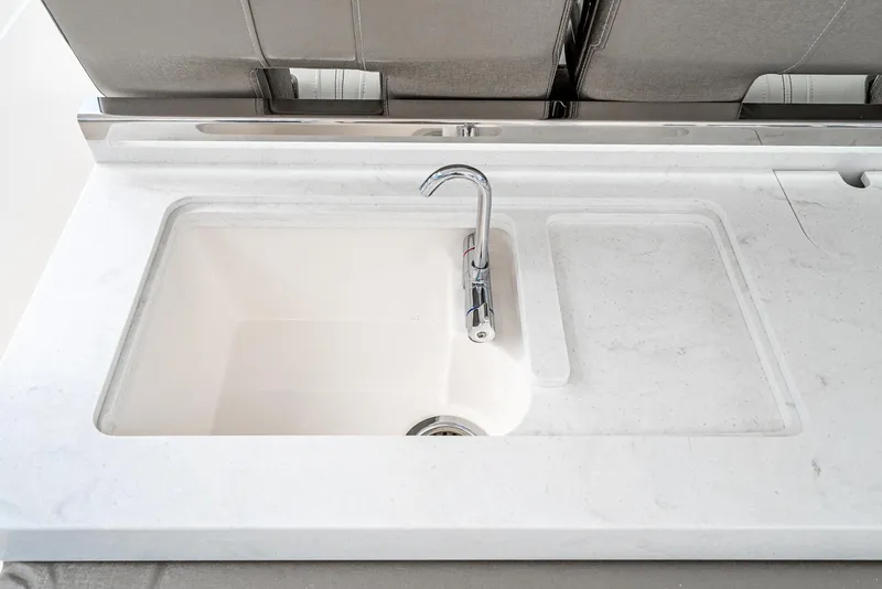 Slide: The Image of 2024 Tiara Yachts 34 LS sink with modern faucet and sleek countertop design. - 35