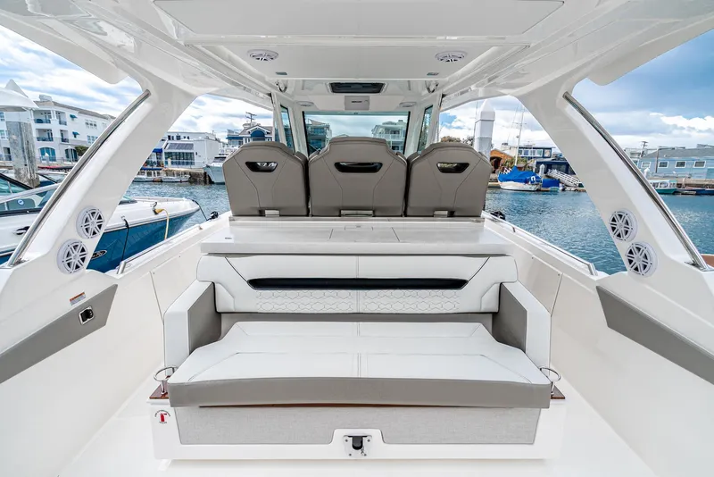 Slide: The Image of 2024 Tiara Yachts 34 LS interior with luxurious seating and modern design. - 37