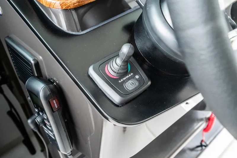 Slide: The Image of 2024 Tiara Yachts 34 LS helm with joystick control and communication device. - 41