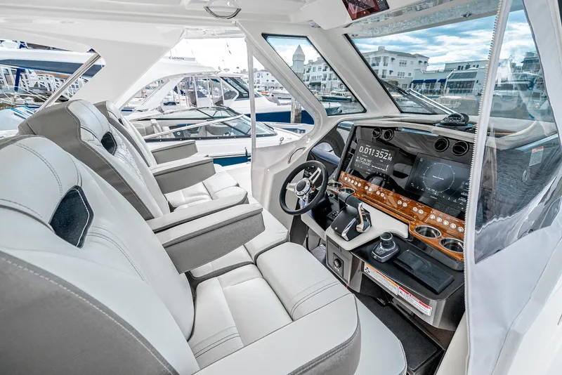 Slide: The Image of 2024 Tiara Yachts 34 LS interior with modern helm and luxurious seating. - 43