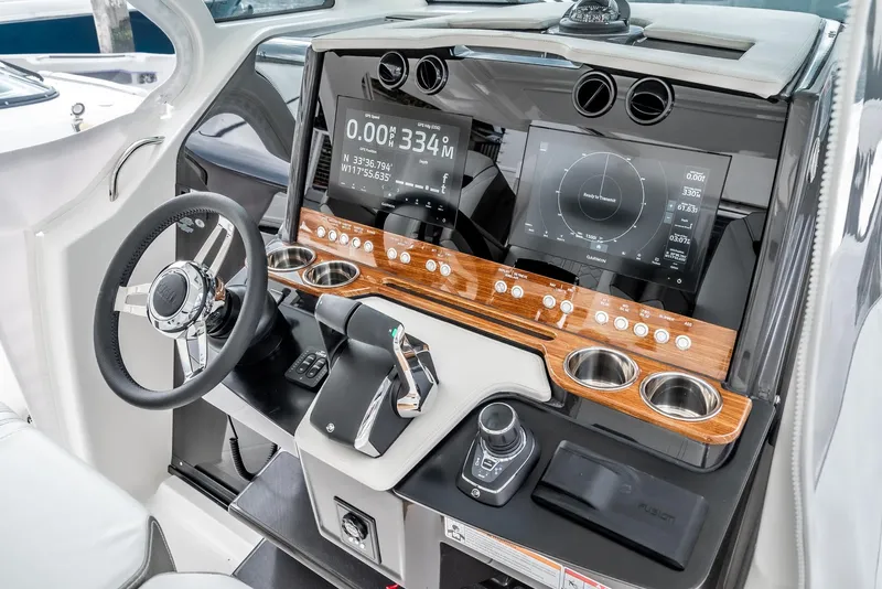Slide: The Image of 2024 Tiara Yachts 34 LS helm with modern controls and dual displays. - 44