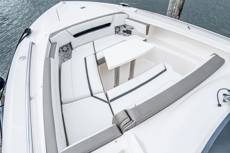 Slide: The Image of 2024 Tiara Yachts 34 LS boat interior with white seating and table. - 9