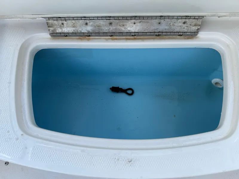 Slide: The Image of Open storage compartment in 2015 Chaparral 21 H2O Sport boat. - 18