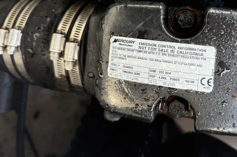 Slide: The Image of Close-up of a Mercury engine label on a 2015 Chaparral 21 H2O Sport boat. - 21