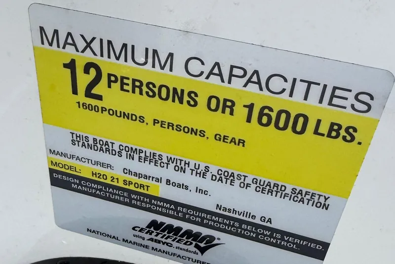Slide: The Image of 2015 Chaparral 21 H2O Sport capacity label: 12 persons or 1600 lbs, U.S. Coast Guard compliant. - 23