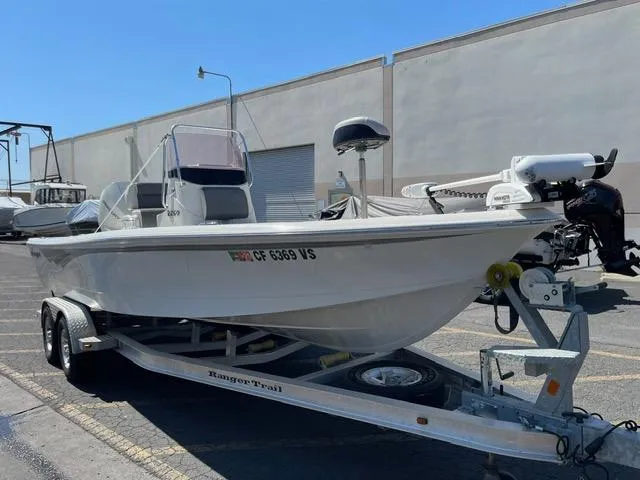 Slide: The Image of 2020 Ranger 2260 Bay boat on trailer in parking lot. - 2