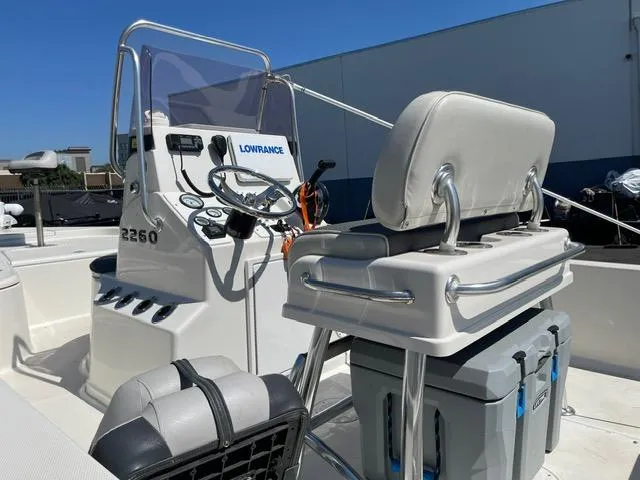 Slide: The Image of 2020 Ranger 2260 Bay boat interior with steering console and seating. - 6