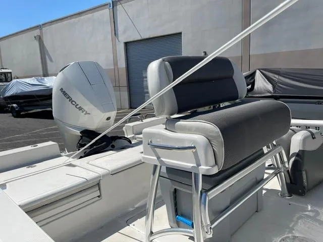 Slide: The Image of 2020 Ranger 2260 Bay boat with Mercury engine and cushioned seating. - 7