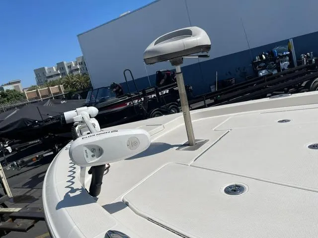 Slide: The Image of 2020 Ranger 2260 Bay boat deck with mounted equipment in a marina setting. - 8