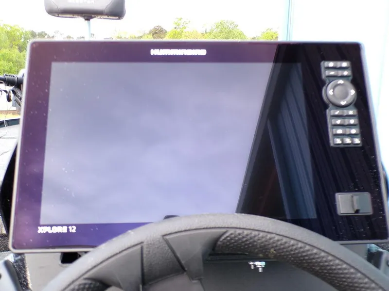Slide: The Image of ```json
{
  "alt_text": "2025 Skeeter ZXR20 boat dashboard with Humminbird Xplore 12 display."
}
``` - 19