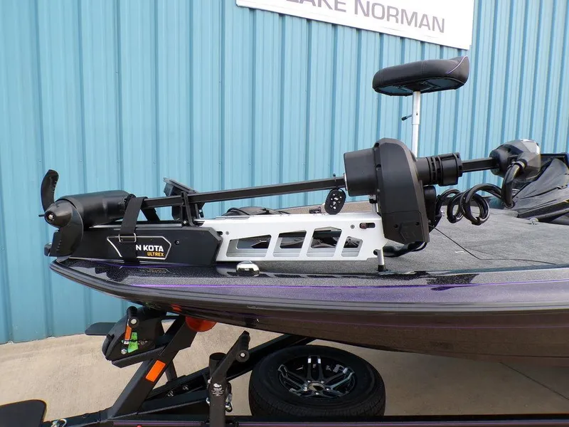 Slide: The Image of 2025 Skeeter ZXR20 boat with Minn Kota trolling motor, parked at Lake Norman. - 23