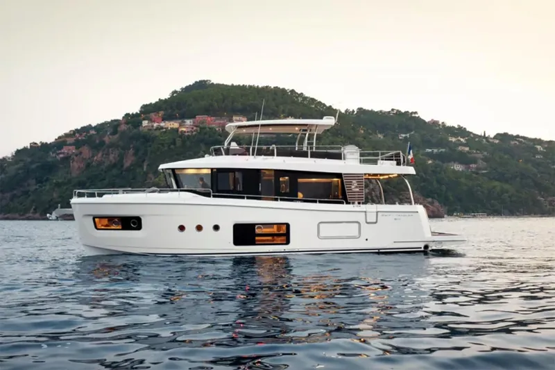 The Image of 2026 Beneteau Swift Trawler 54 cruising on open water, showcasing elegant design. - 0