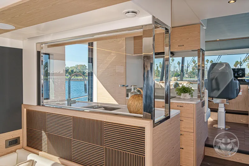 Slide: The Image of Luxurious interior of 2026 Beneteau Swift Trawler 54 with ocean view and modern design. - 16