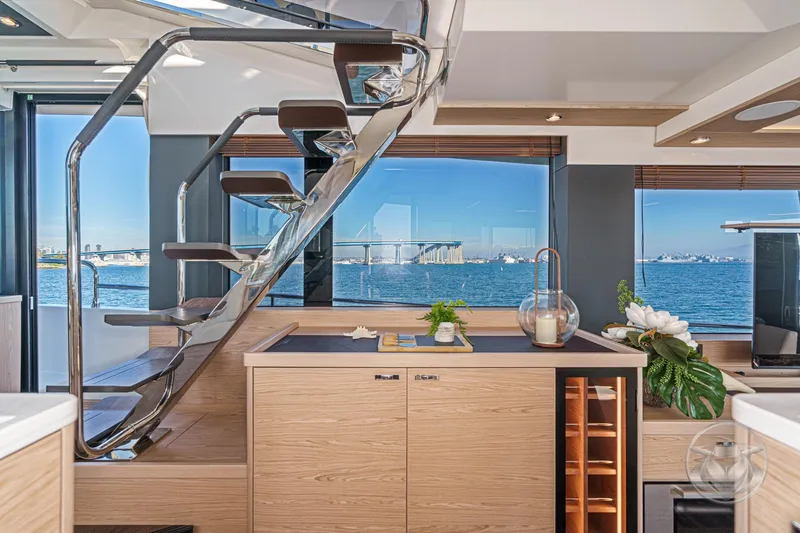 Slide: The Image of Interior of 2026 Beneteau Swift Trawler 54 with modern design and scenic water view. - 19