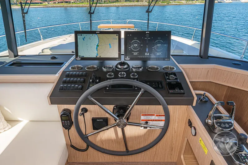 Slide: The Image of Luxurious bedroom interior of 2026 Beneteau Swift Trawler 54, featuring modern design and cozy bedding. - 25